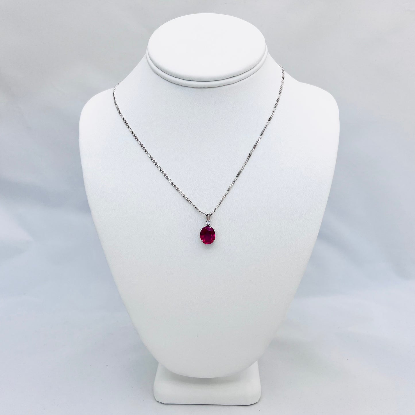 12x10mm Oval Lab Created Ruby Accented .925 Silver Pendant on 1.8mm 18" Figaro Chain